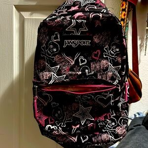 Jansport backpack. With, skulls, stars and hearts, pink and black